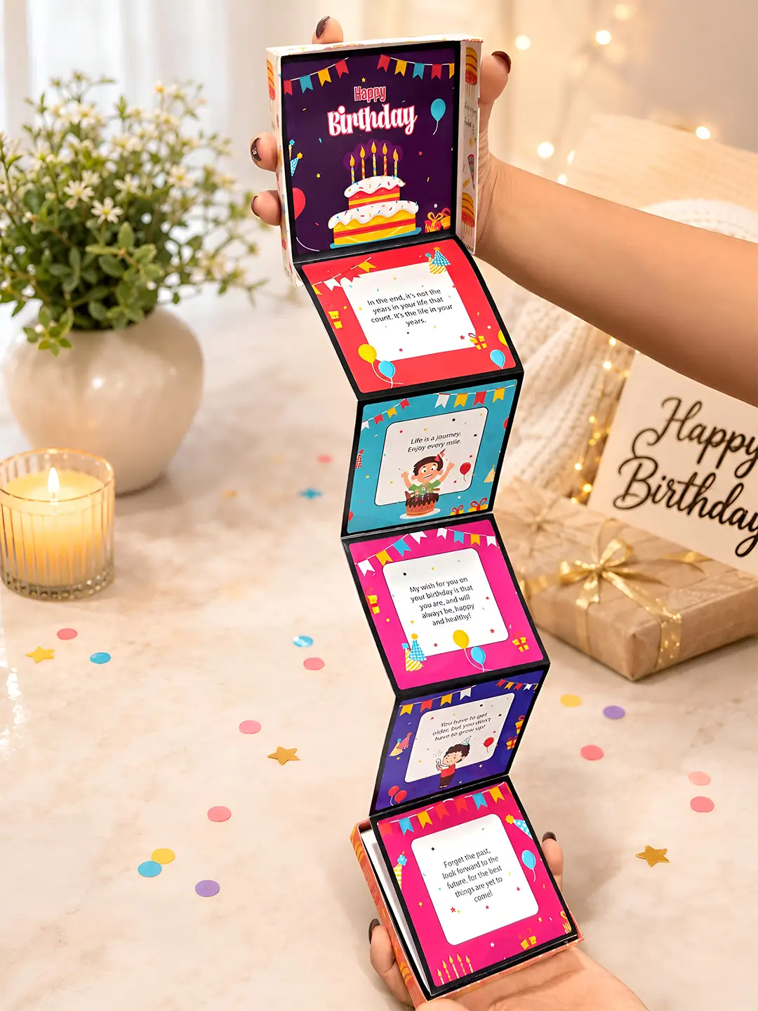 Birthday Celebration Accordion Album with 12 colorful birthday message cards unfolding from themed gift box