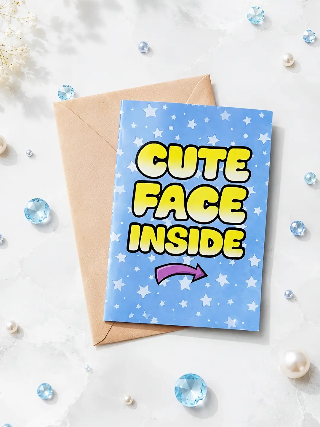 Cute Face Inside Mirror Card open with blue star design, yellow lettering and surprise mirror reflecting the recipient