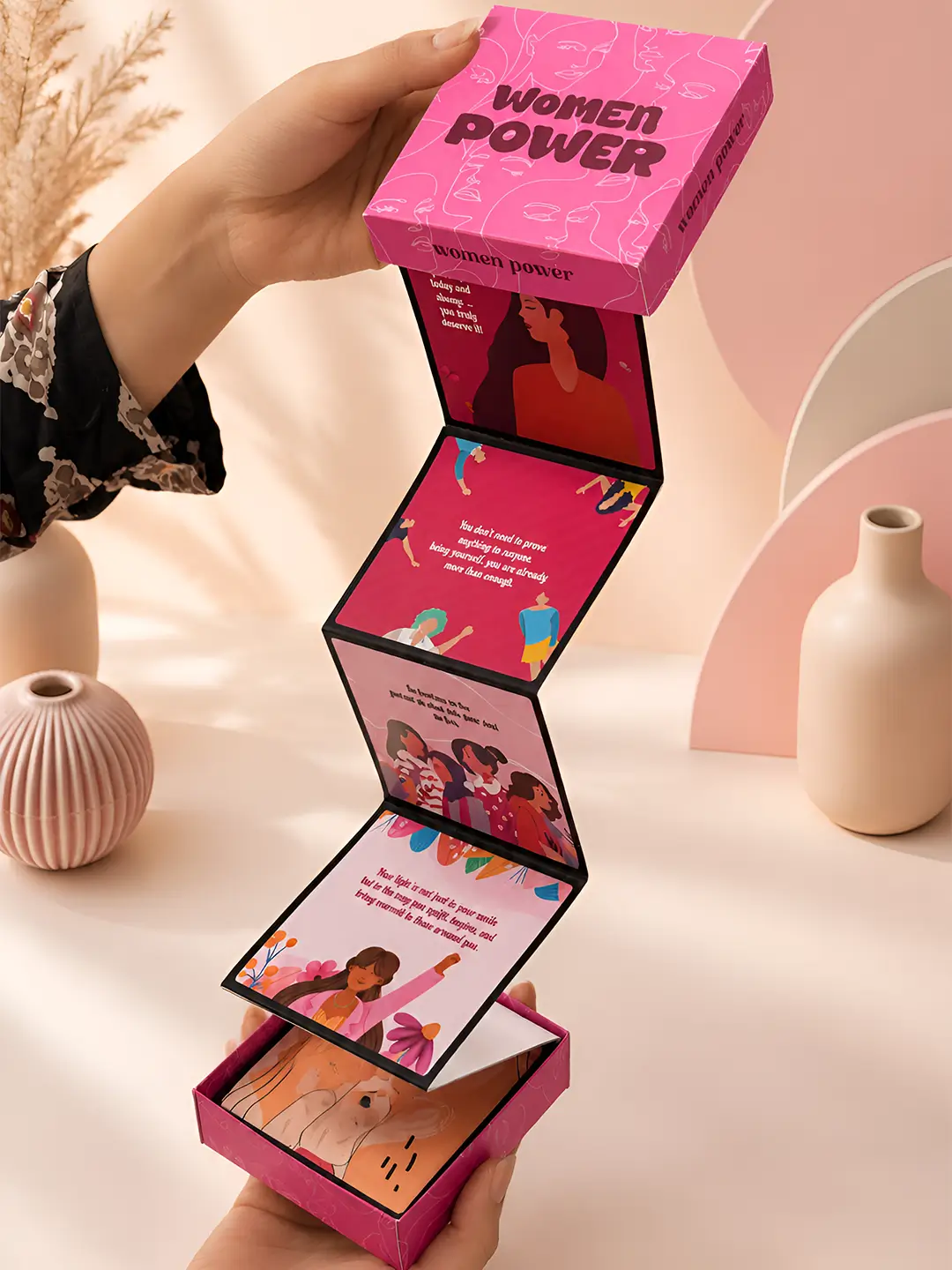 Women Power Accordion Album with 12 empowering message cards unfolding from pink women empowerment theme gift box